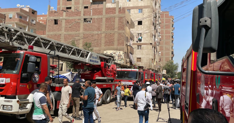 Firefighters and first responders work at the site of the Abu Sefein church fire in Cairo, Egypt, which left at least 41 dead, on Sunday.