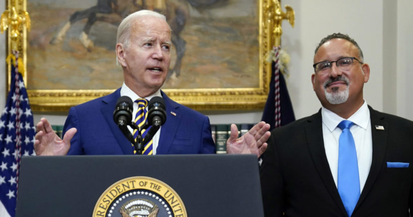 U.S President Joe Biden and Education Secretary Miguel Cardona