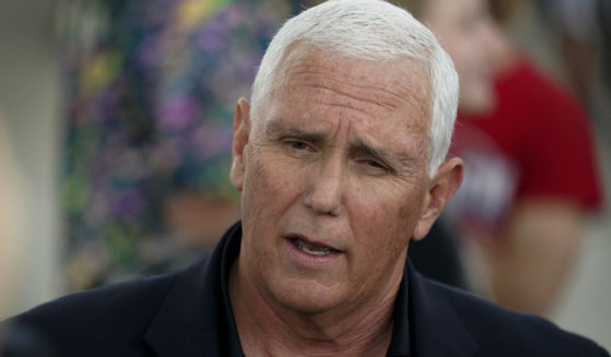 Former Vice President Mike Pence speaks to reporters during a visit to the Iowa State Fair on Friday in Des Moines, Iowa.