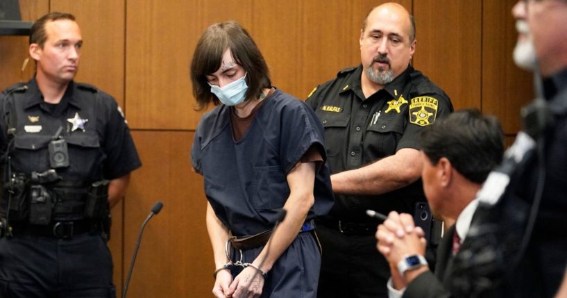 Robert E. Crimo III, walks in to the courtroom during a hearing in Lake County court Wednesday, Aug. 3, 2022, in Waukegan, Ill. Crimo III, accused of killing seven people and wounding dozens more in a shooting at an Independence Day parade in suburban Chicago pleaded not guilty on Wednesday, a week after prosecutors announced he faces 117 felony counts in the attack.