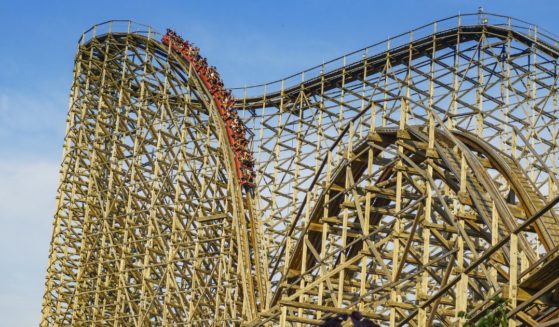 People ride El Toro, a tall wooden roller coaster, at Six Flags Great Adventure in New Jersey on June 20, 2016.