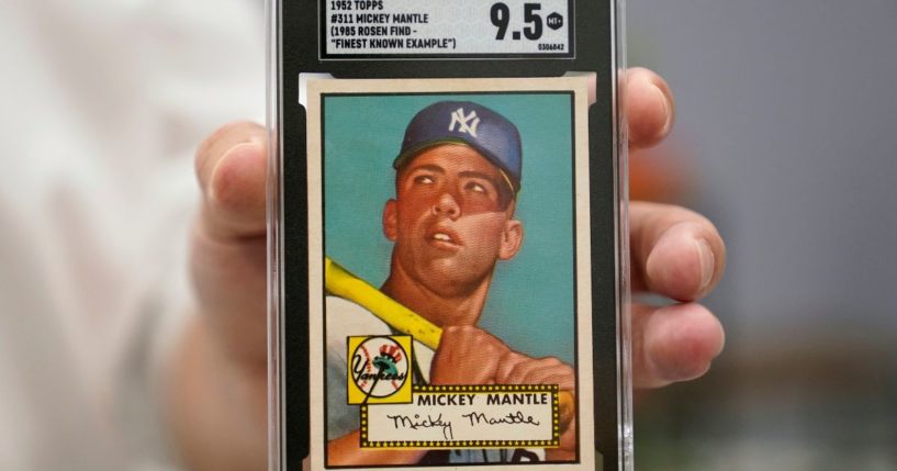 A Mickey Mantle baseball card is displayed at Heritage Auctions in Dallas, on July 21.