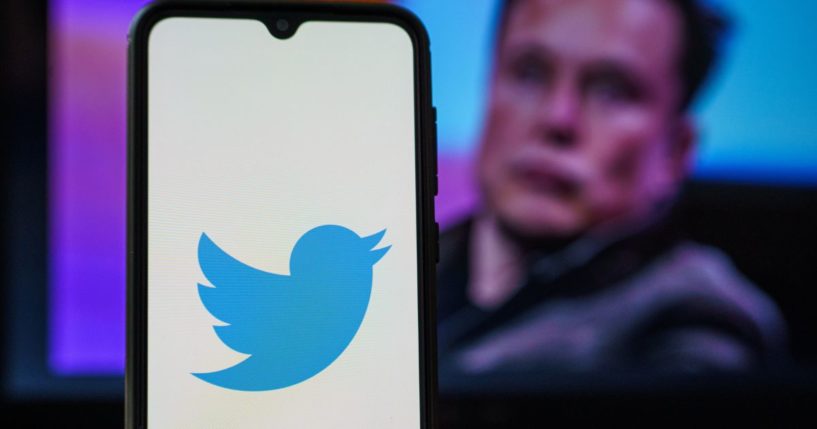 The Twitter logo is seen on a cellphone screen in this stock image.