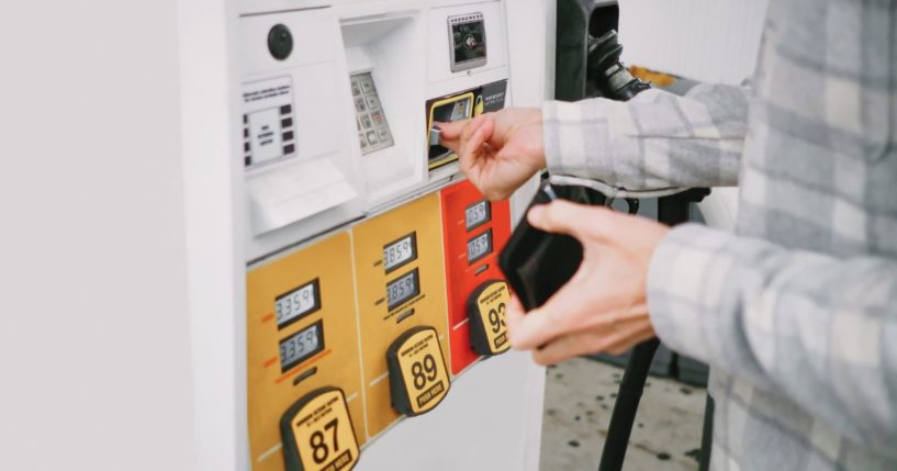 The above stock image is of a man at a gas station.