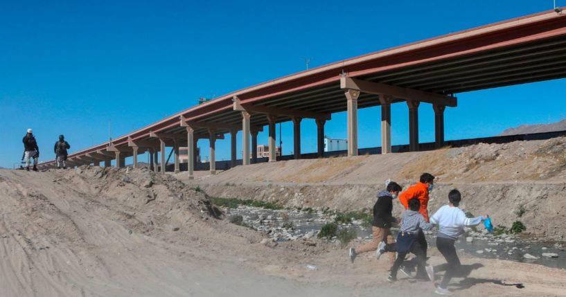 Migrants cross the Rio Bravo to get to El Paso, Texas, from Ciudad Juarez, Mexico, on Feb. 5, 2021.