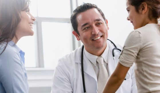 The above stock image is of a girl and her mother.