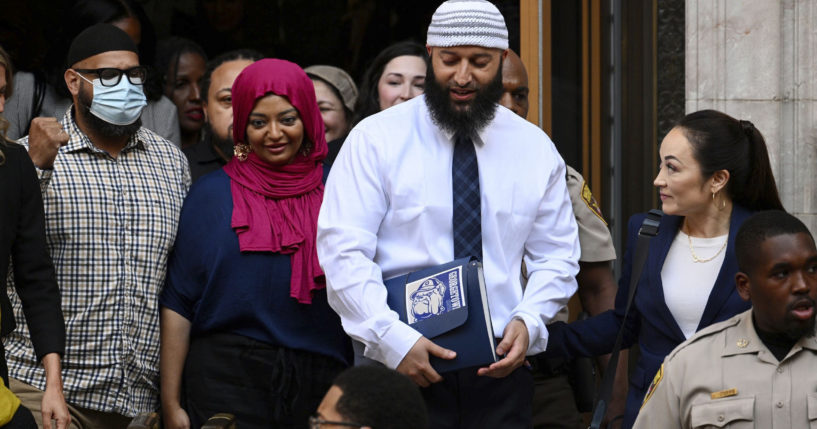 Adnan Syed, center right, leaves the courthouse after a hearing on Sept. 19, 2022, in Baltimore, Maryland.