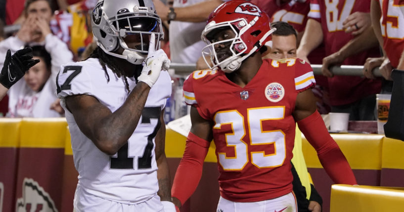 Davante Adams, left, celebrates scoring a touchdown against Jaylen Watson, right, on Monday night during the NFL Monday Night Football Game where the Las Vegas Raiders played the Kansas City Chiefs.