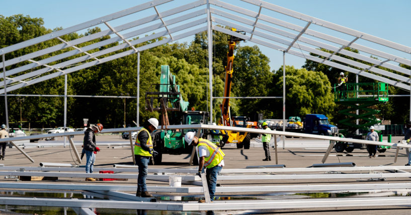 Workers build a hanger-sized tent as a temporary shelter for illegal immigrants in the Bronx, New York, on Sept. 27.