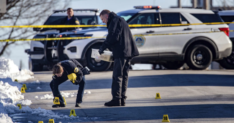 Police investigate a fatal shooting outside of East High School in Des Moines, Iowa, on March 7.