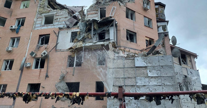 A residential building is seen damaged following night shelling in Mykolaiv, Ukraine, on Sunday.