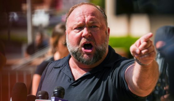 Alex Jones speaks to the media outside Waterbury Superior Court on Sept. 21 in Waterbury, Connecticut.