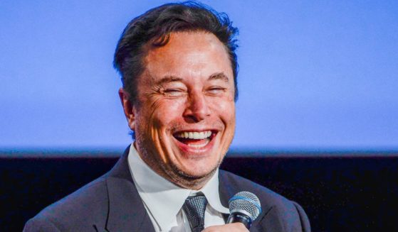 Elon Musk smiles as he addresses guests at the Offshore Northern Seas meeting in Stavanger, Norway on Aug. 29.