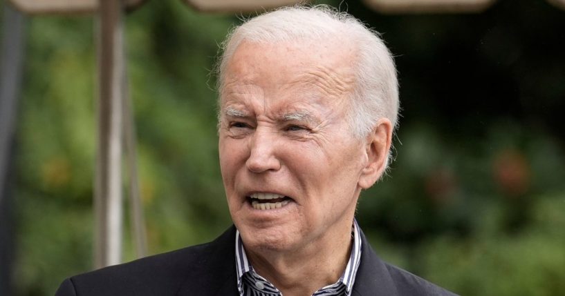 President Joe Biden talks to reporters as he walks to Marine One on the South Lawn of the White House in Washington on Wednesday.