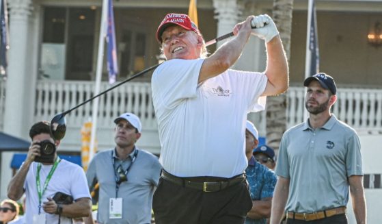 Former President Donald Trump tees off during a visit a day ahead of the LIV Golf Invitational Miami at Trump National Doral Miami golf club in Miami on Thursday.