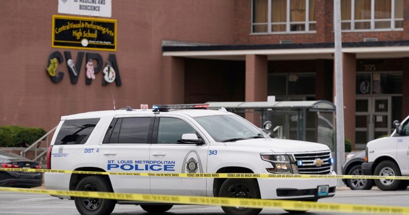 Law enforcement investigates the scene of the shooting at Central Visual and Performing Arts High School in St. Louis, Missouri, on Monday.