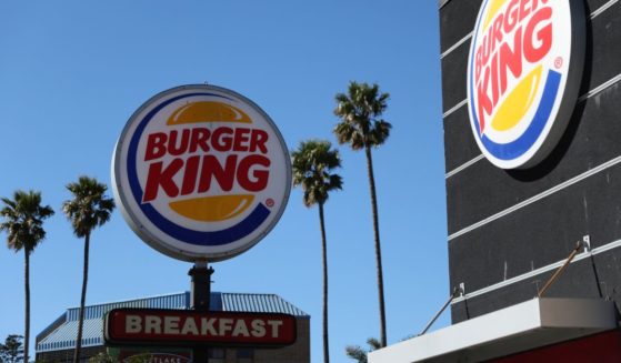 A sign is posted in front of a Burger King restaurant on Feb. 15 in Daly City, California.