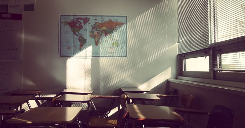 An empty classroom is seen in this stock image.