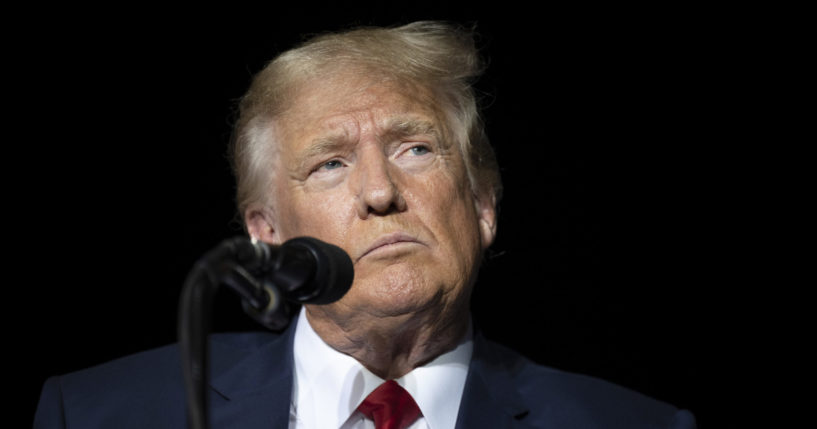 Former President Donald Trump pauses while speaking at a rally at the Minden Tahoe Airport in Minden, Nevada, on Oct 8.