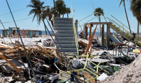 Stairways lead to nowhere after buildings were swept clear in the wake of Hurricane Ian on October 3, 2022 in Fort Myers Beach, Florida. The death toll in the state from Ian rose to at least 100 today following the storm making landfall as Category 4 hurricane, causing extensive damage along the coast as rescue crews continued the search for survivors. (Photo by Joe Raedle/Getty Images)