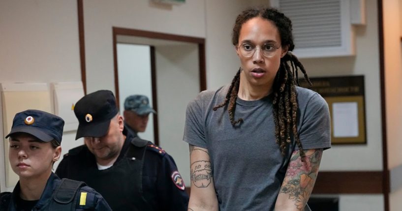 WNBA star and two-time Olympic gold medalist Brittney Griner is escorted from a courtroom after a hearing in Khimki just outside Moscow on Aug. 4.