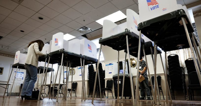 Voters fill out and cast their ballots on Thursday in Sandy Spring, Maryland.