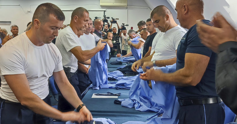 Serb police officers took off their uniforms after a a mass resignation in the town of Zvecan, Kosovo, on Saturday.