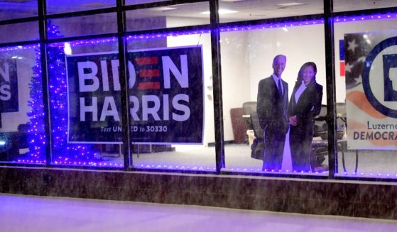 Cardboard cutouts of President-elect Joe Biden and Vice President-elect Kamala Harris are placed by the window of the Luzerne County Democratic headquarters during heavy snowfall on December 16, 2020 in Wilkes Barre, Pennsylvania.