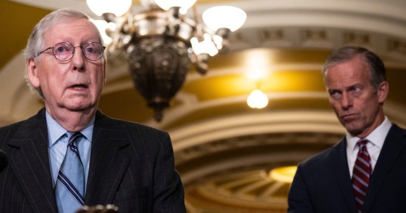 With Senate Minority Whip GOP Sen. John Thune of South Dakota looking on, Senate Minority Leader Mitch McConnell of Kentucky speaks to reporters after meeting with Senate Republicans at the U.S. Capitol Tuesday. GOP Sen. Rick Scott of Florida announced he plans to challenge McConnell for the top Senate GOP leadership post.