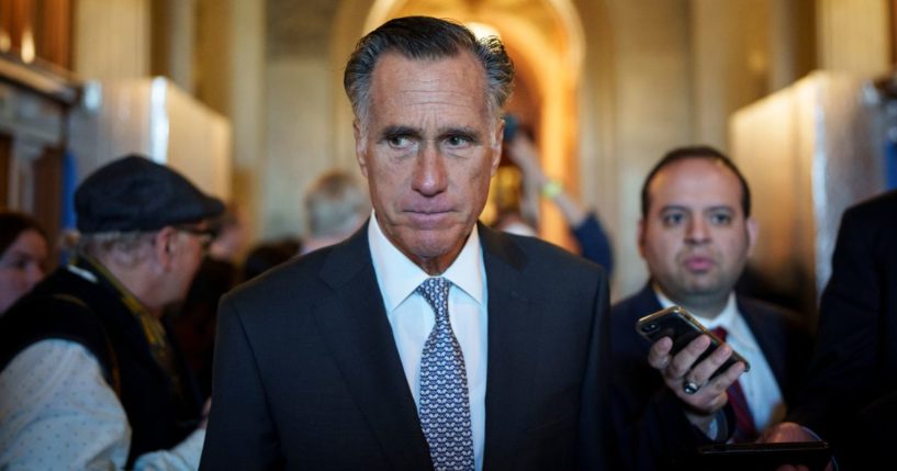 Utah GOP Sen. Mitt Romney leaves the Senate floor after voting yes on a procedural vote on federal legislation protecting same-sex marriages Wednesday at the U.S. Capitol.