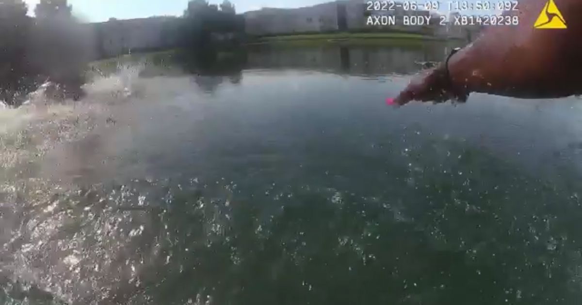 Ofc. Me'Atia Sanderson's body cam footage while she jumped into a retention pond to save a baby.