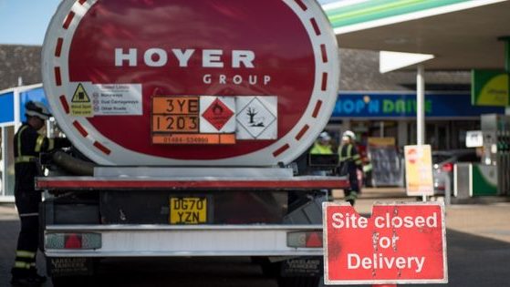 A Hoyer group tanker truck refills a BP gas station in Leigh, England, on Sept. 27, 2021.