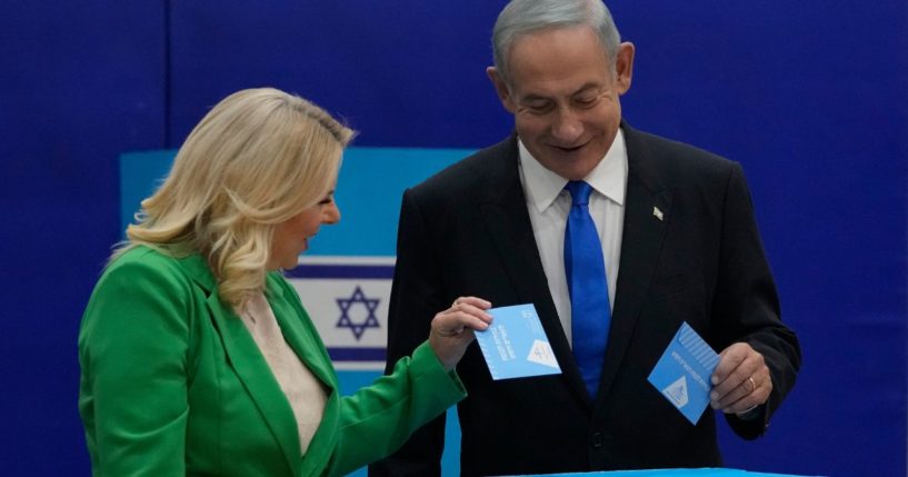 Likud party chairman Benjamin Netanyahu and his wife 'Sara cast their ballots during Israeli election in Jerusalem, Israel on Tuesday.