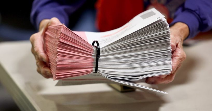 Ballots are processed by an election worker at the Clark County Election Department on Thursday in North Las Vegas, Nevada.