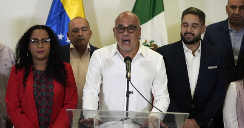 Jorge Rodriguez, center, speaks as part of the Venezuelan government delegation in Benito Juarez International Airport in Mexico City on Friday.