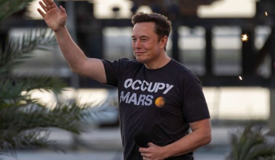 SpaceX founder Elon Musk walks on stage during a T-Mobile and SpaceX joint event on Aug. 25 in Boca Chica Beach, Texas.