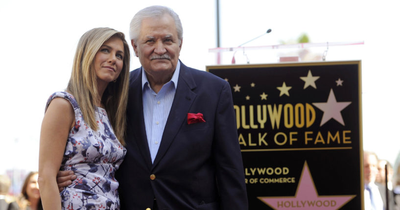 Actress Jennifer Aniston poses with her father, actor John Aniston, after she received a star on the Hollywood Walk of Fame in Los Angeles on Feb. 23, 2013.