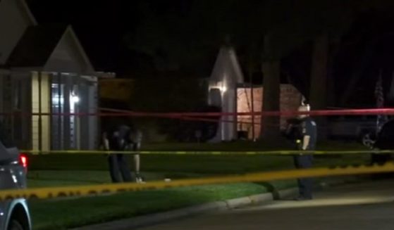 Police tape outside the home in Katy, Texas, where a suspected home invader was killed Thursday.