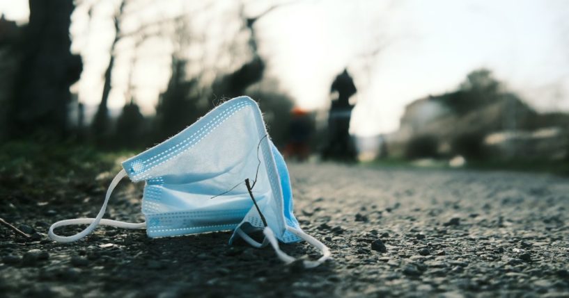 A mask sits on the ground in the above stock image.