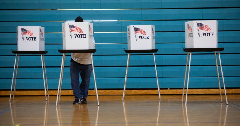 A man votes in the 2022 midterm election on Nov. 8 in Lansing, Michigan.