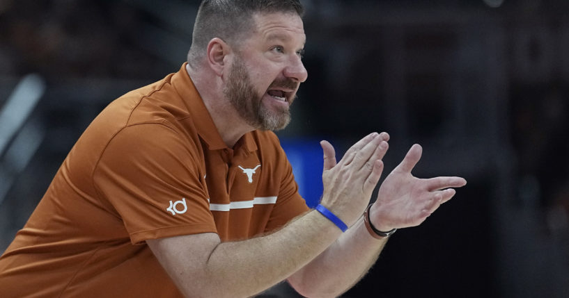 Texas head coach Chris Beard talks to his players during the first half of an NCAA college basketball game against Arkansas-Pine Bluff in Austin, Texas, on Saturday.