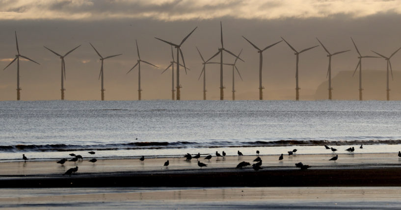 An offshore wind farm is visible from the beach in Hartlepool, England, on Nov. 12, 2019.