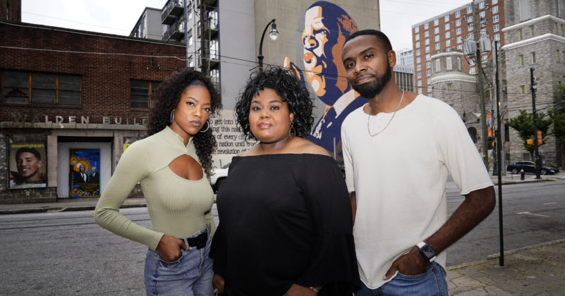 D'Zhane Parker, left, Cicley Gay, center, and Shalomyah Bowers, right, pose for a portrait on May 13 in Atlanta.