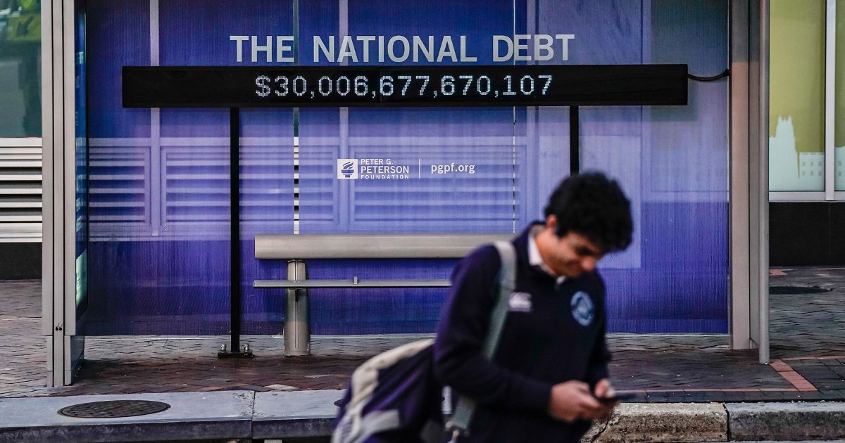 A Peterson Foundation billboard displaying the national debt is pictured on 18th Street in downtown Washington on Feb. 8.