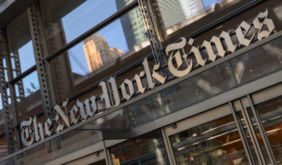 The sign for The New York Times is displayed outside the company's building in New York City on Feb. 1.