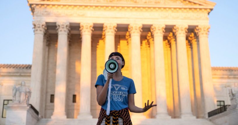 A pro-abortion activist speaks outside the Supreme Court on Sept. 2, 2021, in Washington, D.C.