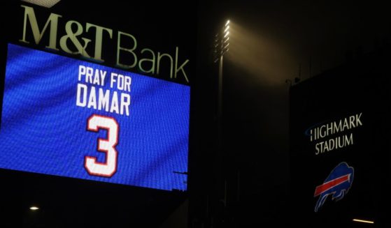 Buffalo Bills fans attend a candlelight prayer vigil for safety Damar Hamlin at Highmark Stadium in Orchard Park, New York, on Tuesday.