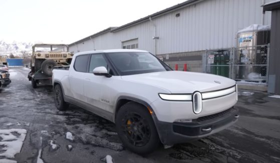 A YouTuber tows his electric Hummer with his electric Rivian.