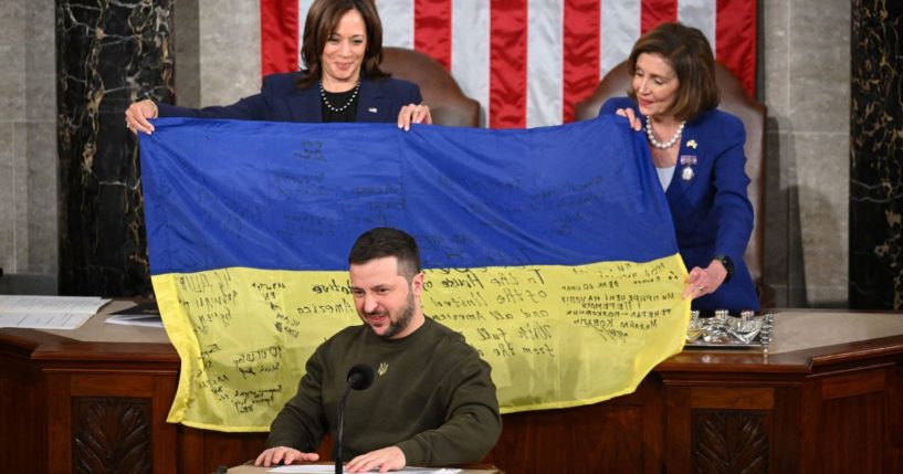 Ukrainian President Volodymyr Zelensky addresses the U.S. Congress as U.S. Vice President Kamala Harris, left, and U.S. House Speaker Nancy Pelosi hold a Ukrainian flag at the U.S. Capitol in Washington, D.C. on Dec. 21, 2022.