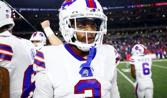 Damar Hamlin #3 of the Buffalo Bills stands in the team huddle prior to an NFL football game against the Cincinnati Bengals at Paycor Stadium on Jan. 2 in Cincinnati.